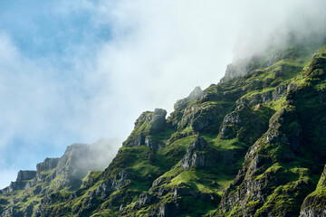 Sticker - Majestic rocks with grass on mountain in cloud