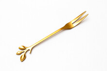 Top View Of Golden Fork Isolated White Background.
