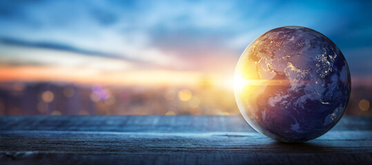 Wall Mural - planet earth on the background of blurred lights of the city. concept on business, politics, ecology