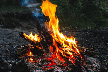 Bright hot campfire on a dark night