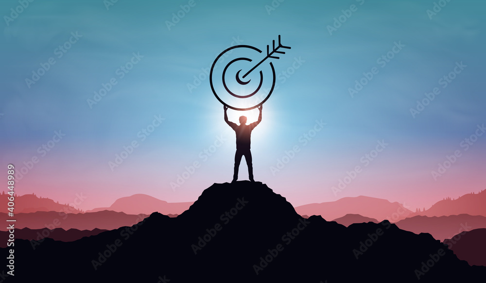 Targeting the business goal and achievement success concept. Businessman standing on top of mountain and holding target board at sunset background. Vision of businessman towards organization company - obrazy, fototapety, plakaty 