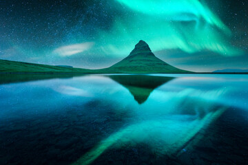 Wall Mural - aurora borealis northern lights over kirkjufell mountain volkano. amazing night scene near famous ki