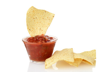 closeup nacho corn chips with bowl of salsa