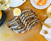 Espeto De Sardinas, Famous Dish Of Costa Del Sol, Charcoal Grilled Sardines Served With Slice Of Lemon