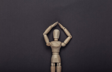 Wall Mural - Protected wooden mannequin on gray background