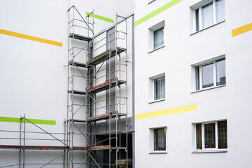 Wall Mural - renovation of the facade of an apartment house using scaffolding