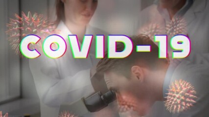 Poster - Animation of covid 19 text and 3d cells floating over scientists using microscope