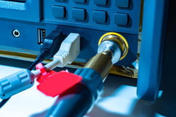Poster - wired connection of computer equipment. wires with connectors are inserted into the power supply. te