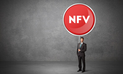 Young business person holdig traffic sign with NFV abbreviation, technology solution concept