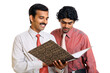Two Indian business peoples with files on white