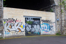 7 July 2020 Part Of The Old Station Wall With A Blocked Up Arch In Sheffield England Now Covered With Graffiti. This Railway Bridge Is Preserved As A Significant Historic Landmark