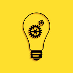 Poster - Black Light bulb and gear inside icon isolated on yellow background. Innovation concept. Long shadow style. Vector.