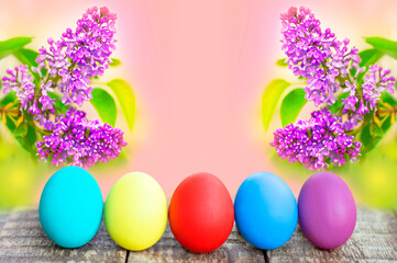 colorful easter eggs on flower background with copy space. Easter background