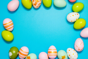 Wall Mural - Easter Eggs. Colorful Easter eggs on blue background with copy space