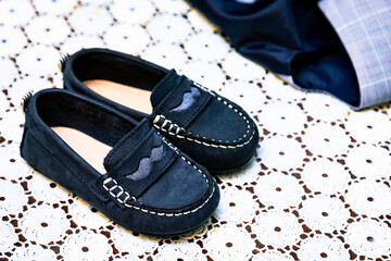 Sticker - High angle shot of a pair of loafers for children under the light