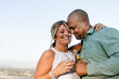 © Rawpixel.com - Husband and wife having a drink on the balcony