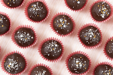 Wall Mural - Chocolate coated almond London cookies in red paper cup