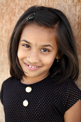 Wall Mural - Indian beautiful teen girl posing to camera with smile