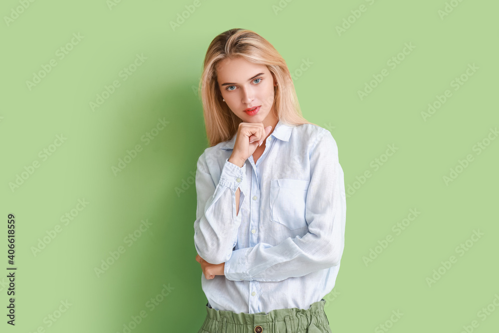 Beautiful young woman on color background