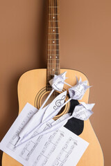 Sticker - Paper flowers, music sheets and guitar on color background