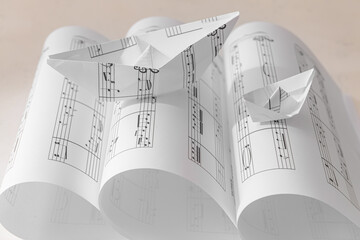 Wall Mural - Paper boat with notes on rolled music sheets