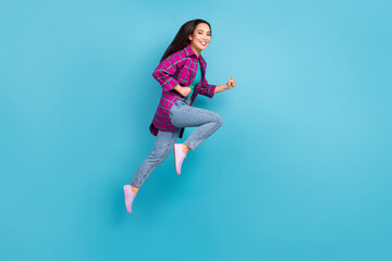 Sticker - Full size profile photo of attractive lady running fast wear purple checkered long shirt isolated on blue color background