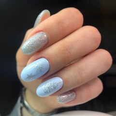 Creative New Year's manicure. Snow manicure on colored nail Polish with silver snowflakes