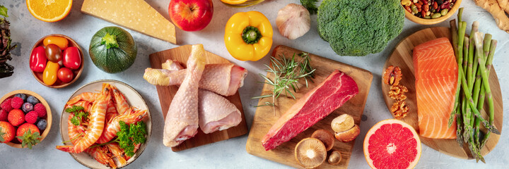 food variety panorama, shot from above. a selection of healthy foods, meat and fish, fruit and veget