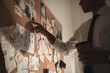© New Africa - Detective looking at evidence board in office, closeup
