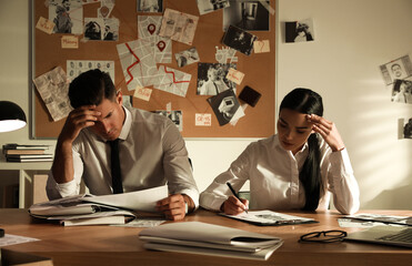 Sticker - Professional detectives working at desk in office