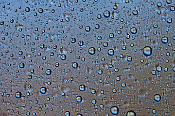 gray wet background / raindrops to overlay on the window, weather, background drops of water rain on the glass transparent