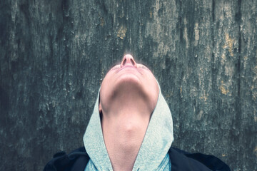 vision, portrait of a young man with closed eyes who looks up