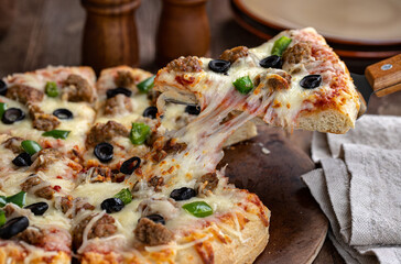 Wall Mural - Sausage Pizza With Black Olives and Peppers