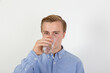 © travelview - teenage boy drinking water out of a glass