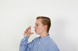 © travelview - teenage boy drinking water out of a glass