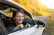 © Kirill Gorlov - Portrait of young adult beautiful caucasian woman driver enjoy roadtrip adventure traveling by car on mountain nature forest countryside landscape. Happy female person family journey trip lifestyle