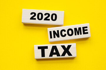 Wall Mural - words INCOME TAX 2020 written on cubes . You can use in business, marketing and other concepts.