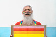 © Alessandro Biascioli - Happy senior man celebrating gay pride festival event - LGBT social movement concept