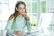 © aletia2011 - Portrait of  businesswoman working in headphones  in office
