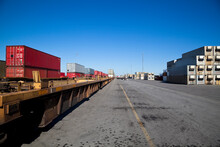 Rail Yard With Containers Loaded Onto Train