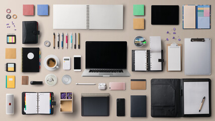 Flat lay top view office desk working space with laptop and supplies on gray background.