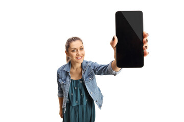 Canvas Print - Young woman holding mobile phone screen in front of camera