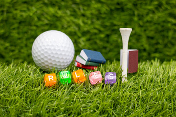 Golf RULES is on green grass background with books