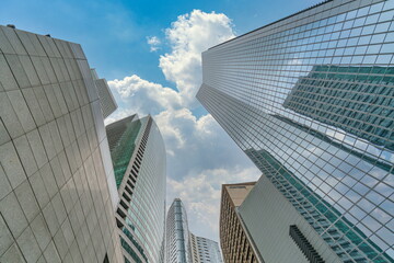 Wall Mural - Financial district in modern city with skyscraper and office building