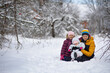 © Evgenia Tiplyashina - Three children on a walk in winter, a teenager