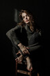 © Zaliya - Sensual portrait of beautiful woman in sun light. Dark background