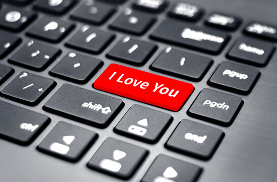 The red button on the black keyboard says I Love You