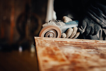 sanding wood, cleaning paint of an old vintage door, restoring antique furniture