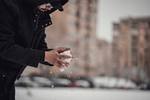 Snowball Fight. Man Making And Throwing Snowball