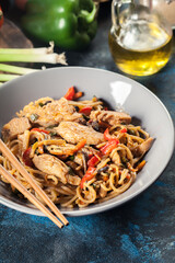 Wall Mural - Chicken chow mein. Fried noodles with chicken and vegetables